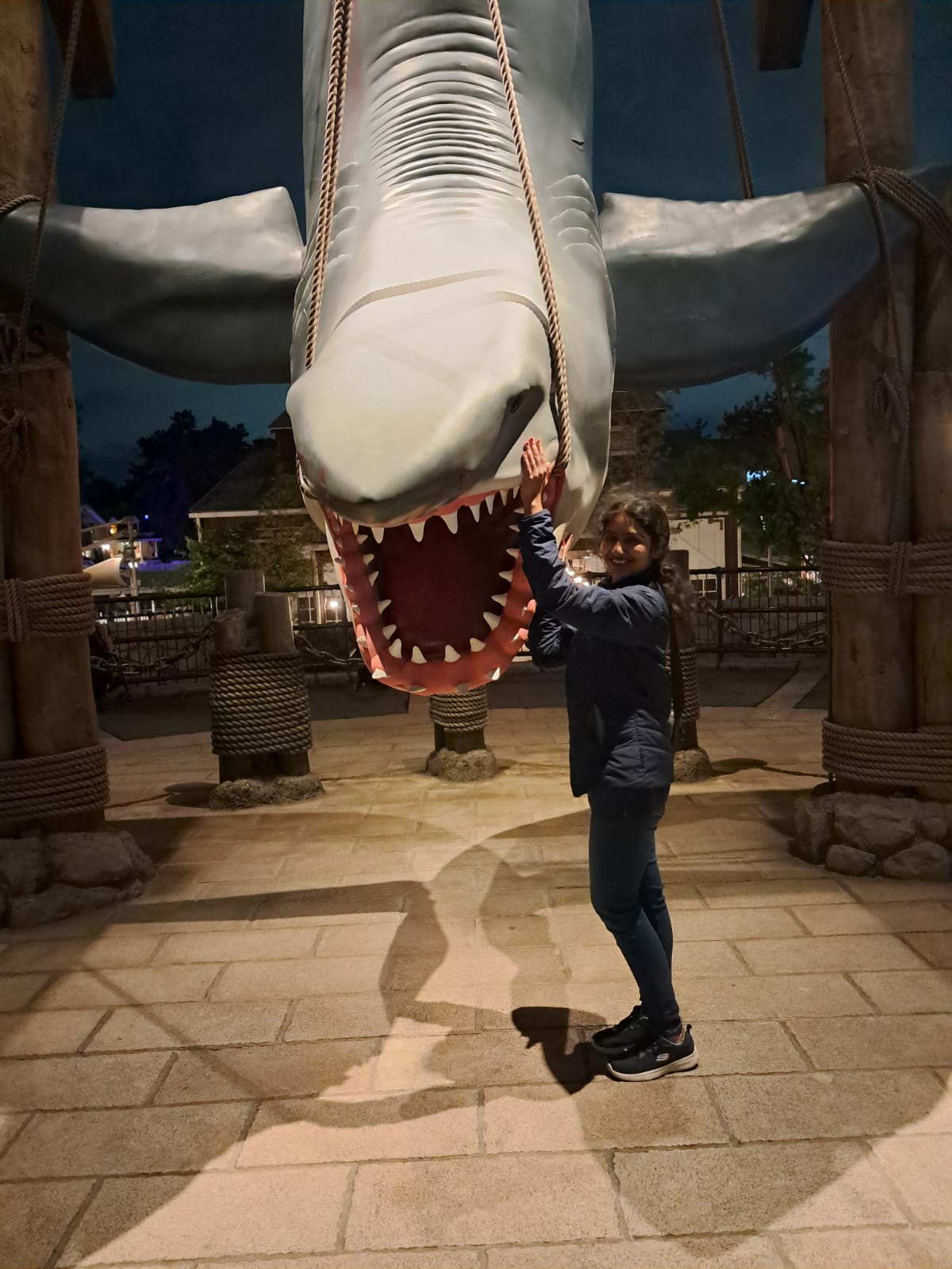 Akshita posing with the JAWS shark at Universal Studios Japan