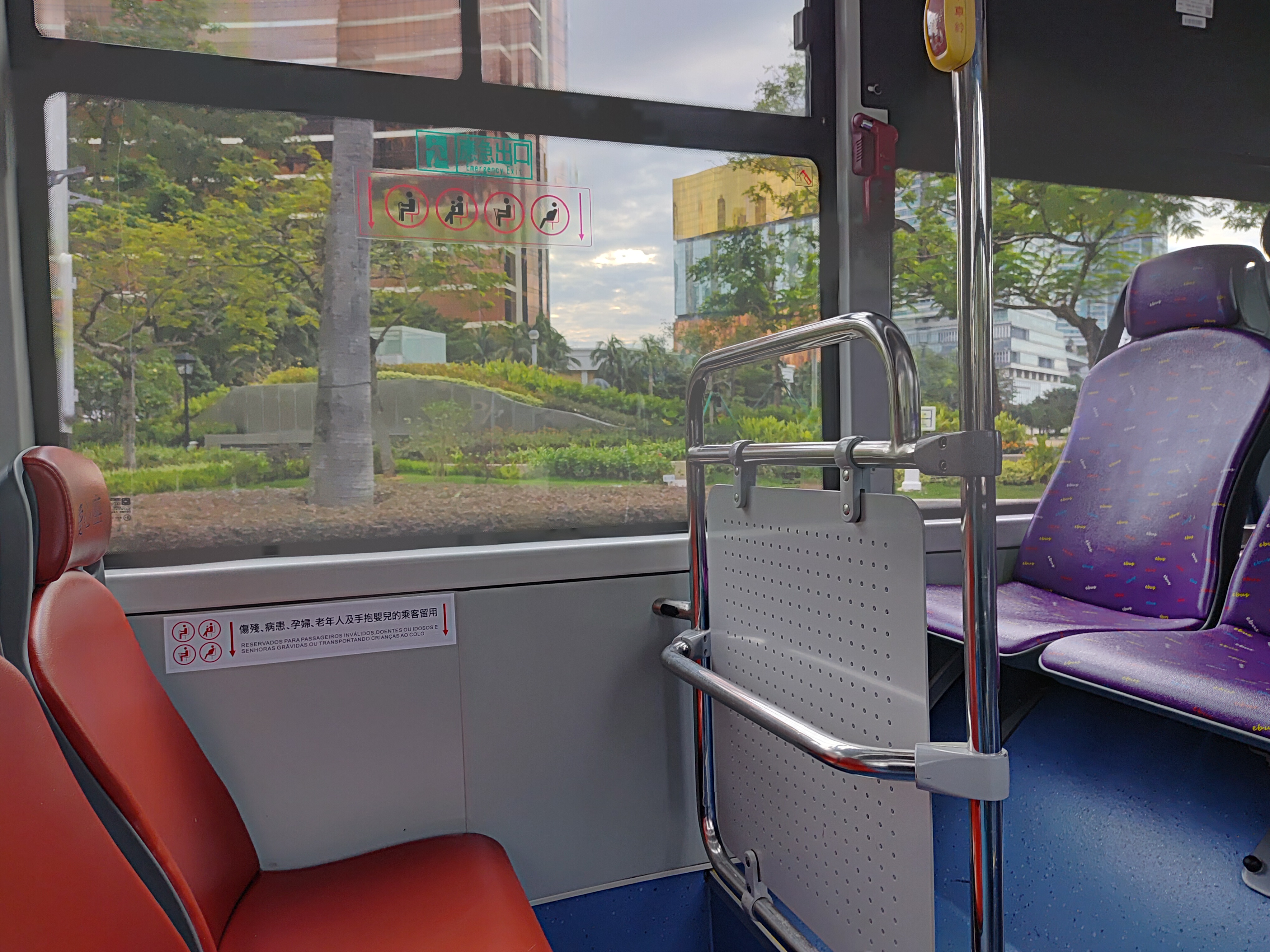 Macau public bus driving on a street in Taipa or Macau Peninsula