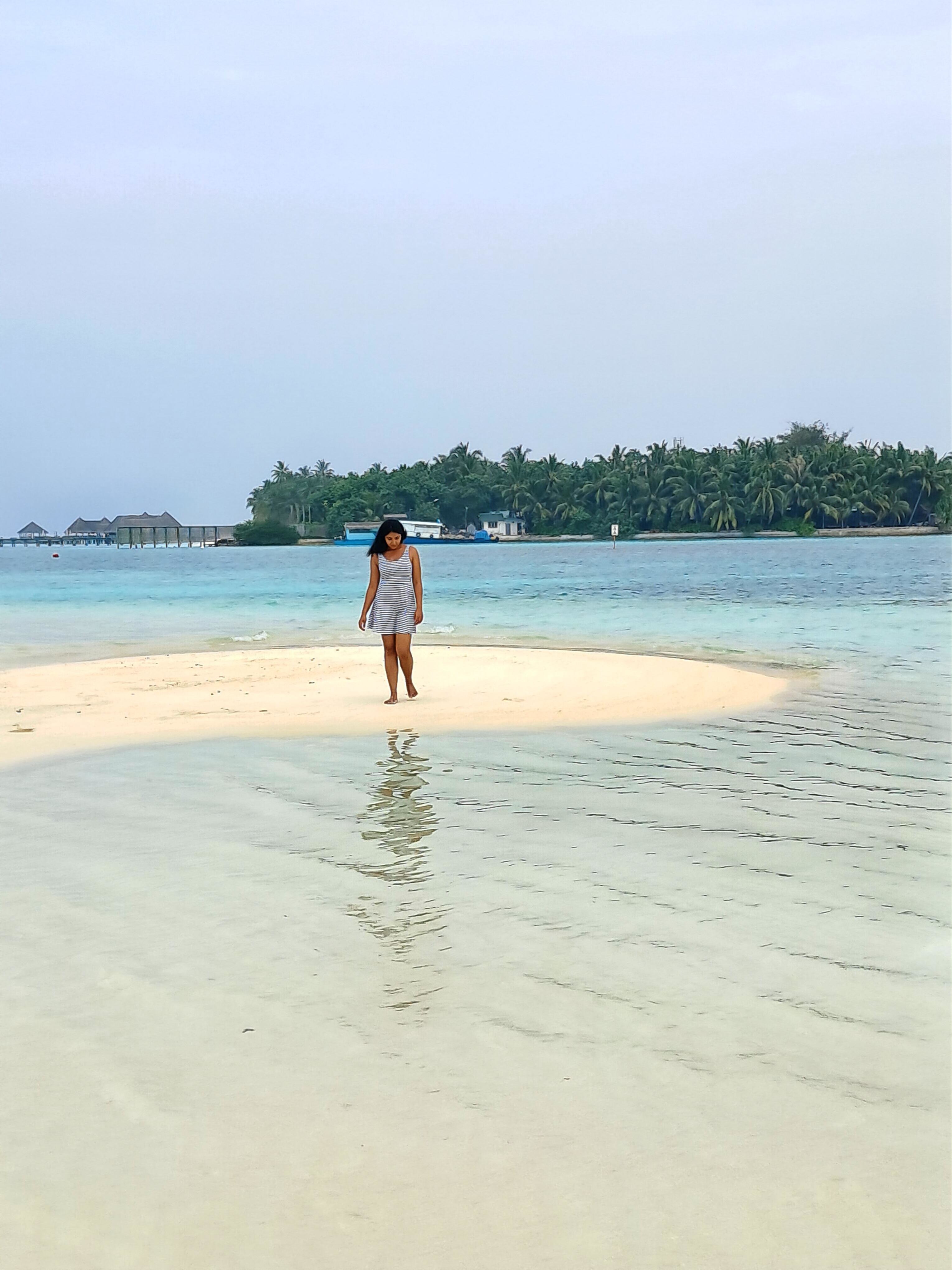 Pristine sandbank surrounded by turquoise water